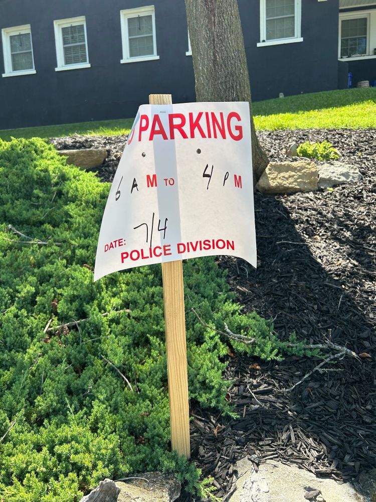 A “no parking” sign with the edges folding over 