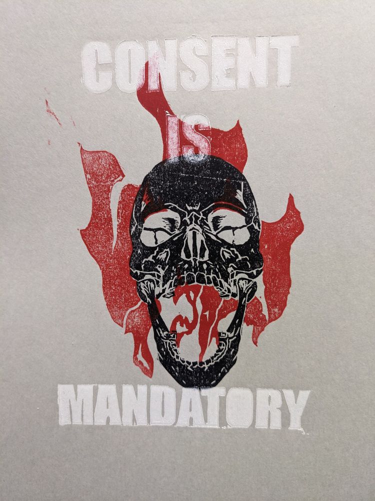 Black skull with mouth open screaming, red flames, white block text reading CONSENT IS MANDATORY