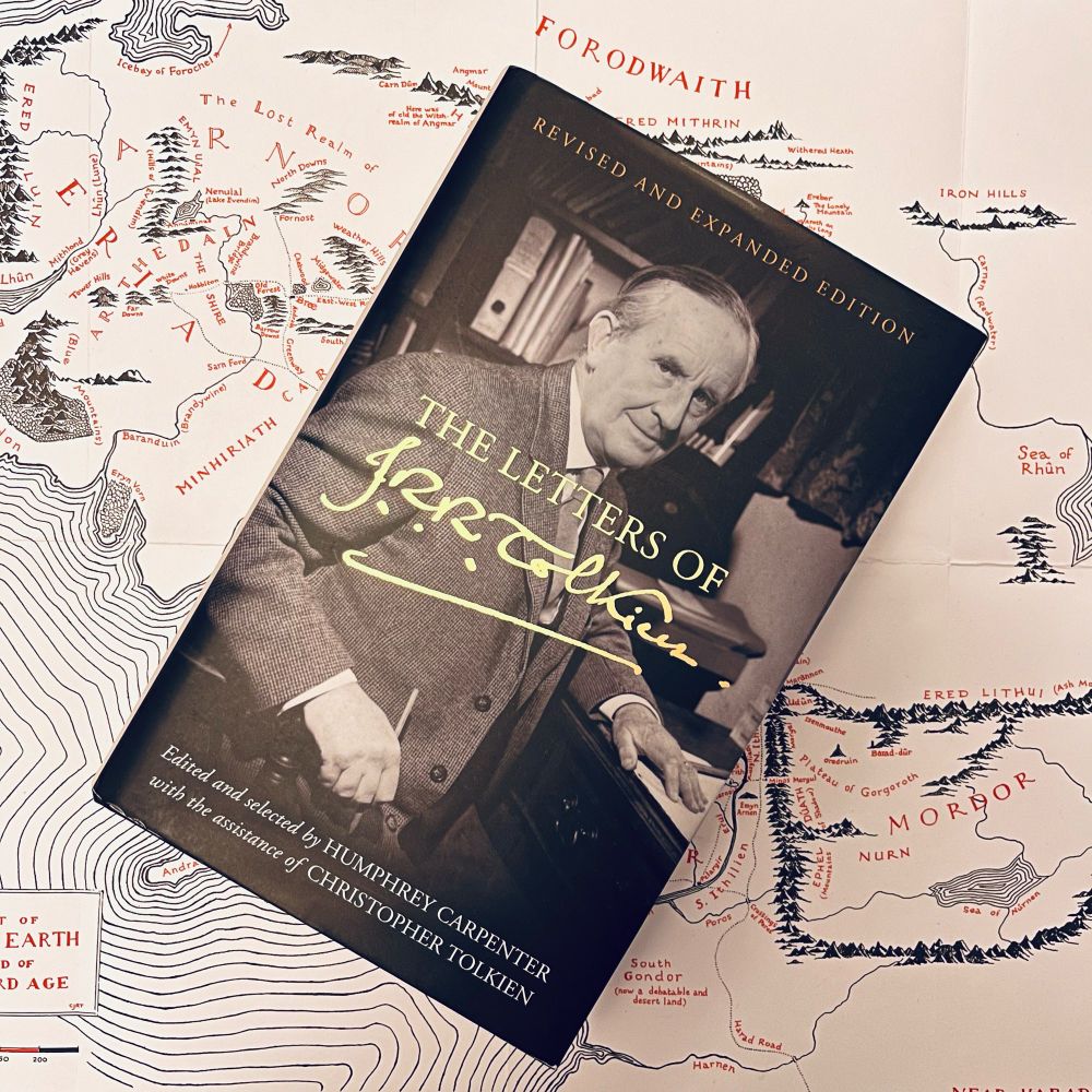 Photo of the Revised and Expanded Edition of The Letters of J.R.R. Tolkien with a map of Middle-earth in the background 