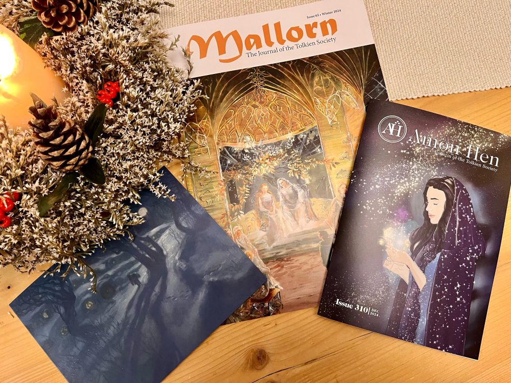 Photo of the 2024 Tolkien Society Christmas mailing: the bulletin Amon Hen, peer-reviewed journal Mallorn and the Christmas card with art by Donato Giancola