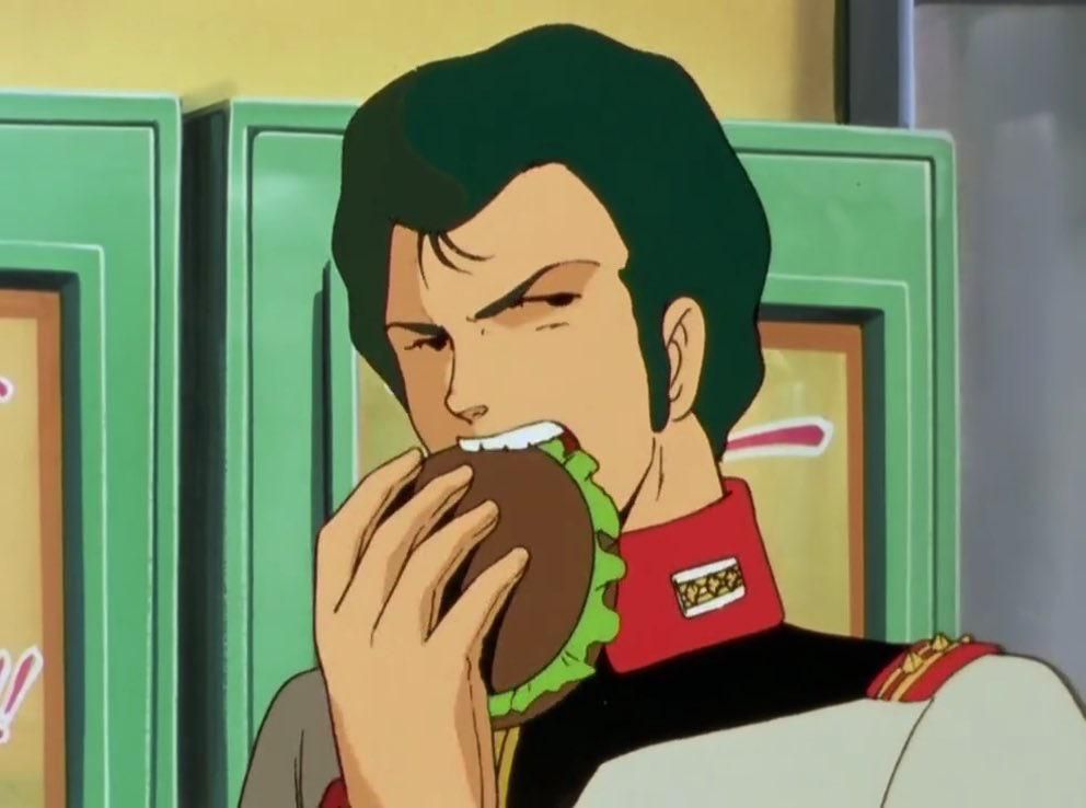 A screenshot of Bright Noa, chomping into a hamburger.