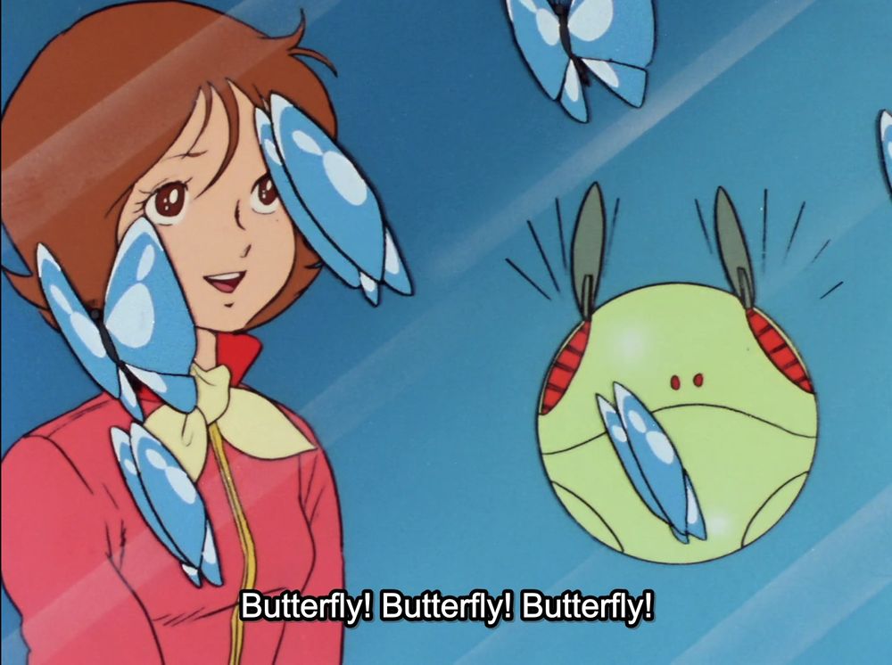 A screenshot from "Mobile Suit Gundam" (1979). It shows Fran Bow and Haro looking at blue butterflies flying near the White Base through a glass window. Fraw is smiling happily, and Haro's "ears" flutter much like a butterfly's wings.