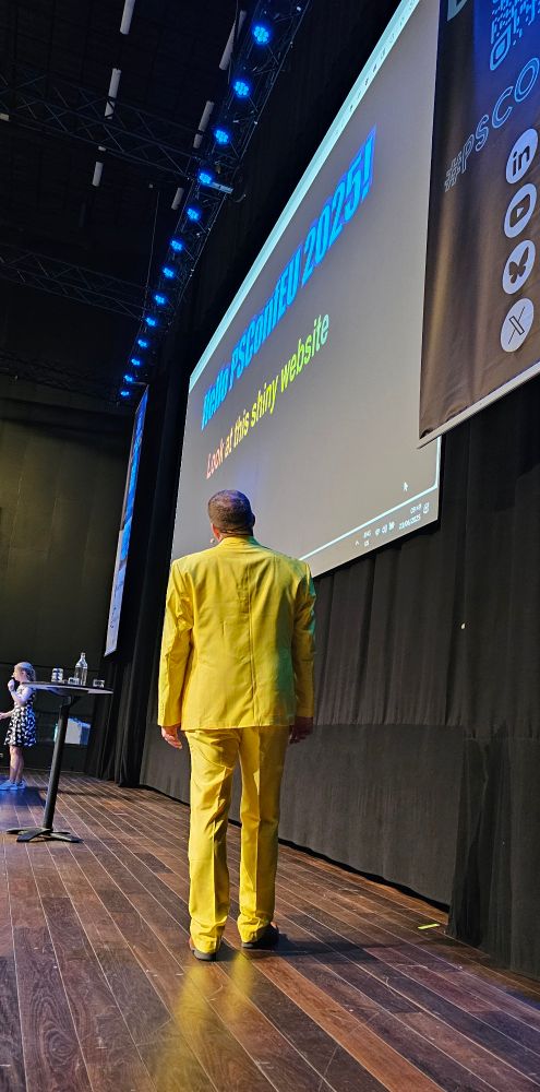 Gael in his yellow suit on stage. 