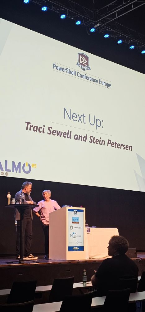 Traci and Stein on stage with their intro slide