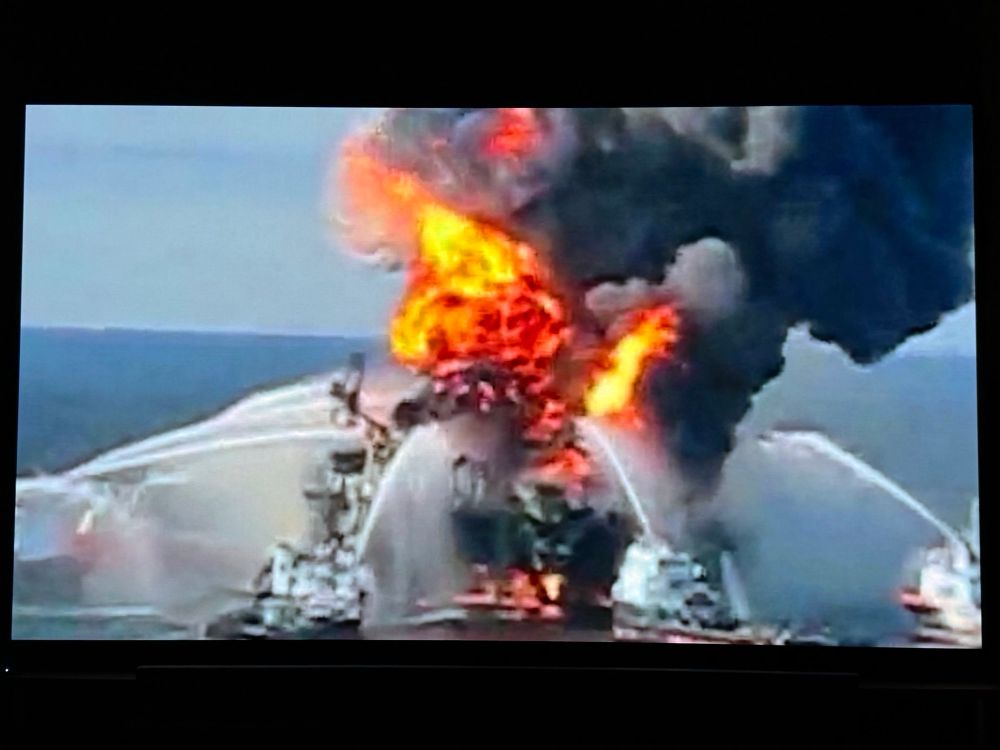 The Deepwater oil rig on fire with boats trying to put it out shown in the 2025 WW2 movie