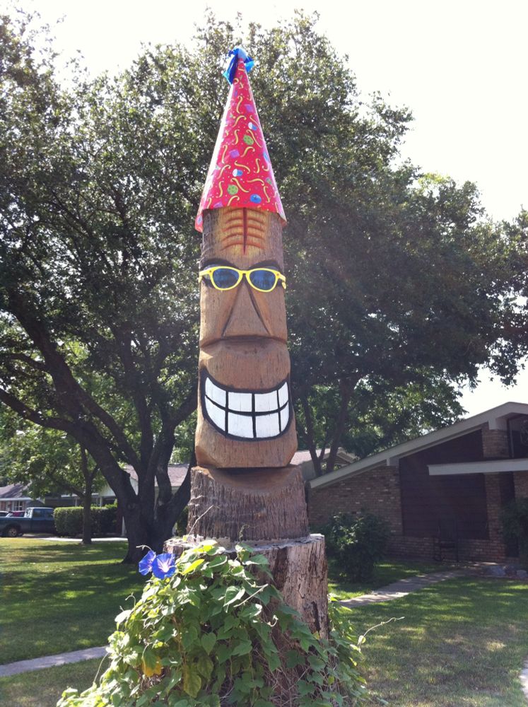 Tiki in sunglasses and birthday hat