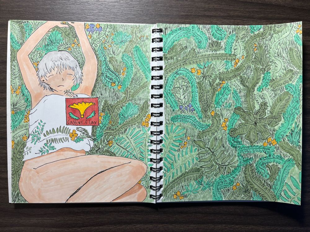 Drawing of a large woman lying on a field of plants, mushrooms and flowers. A red square is in the middle of the page with a ornamental design and the text “Cassius Clay”