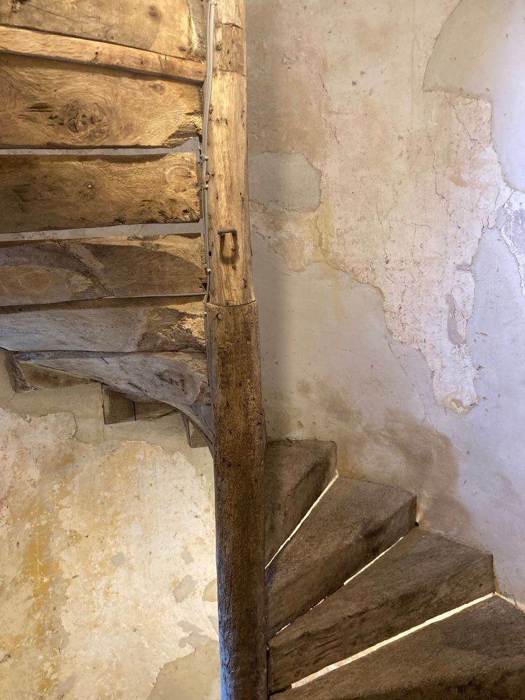 Spiral staircase. The central post is thought to be from a ship mast.