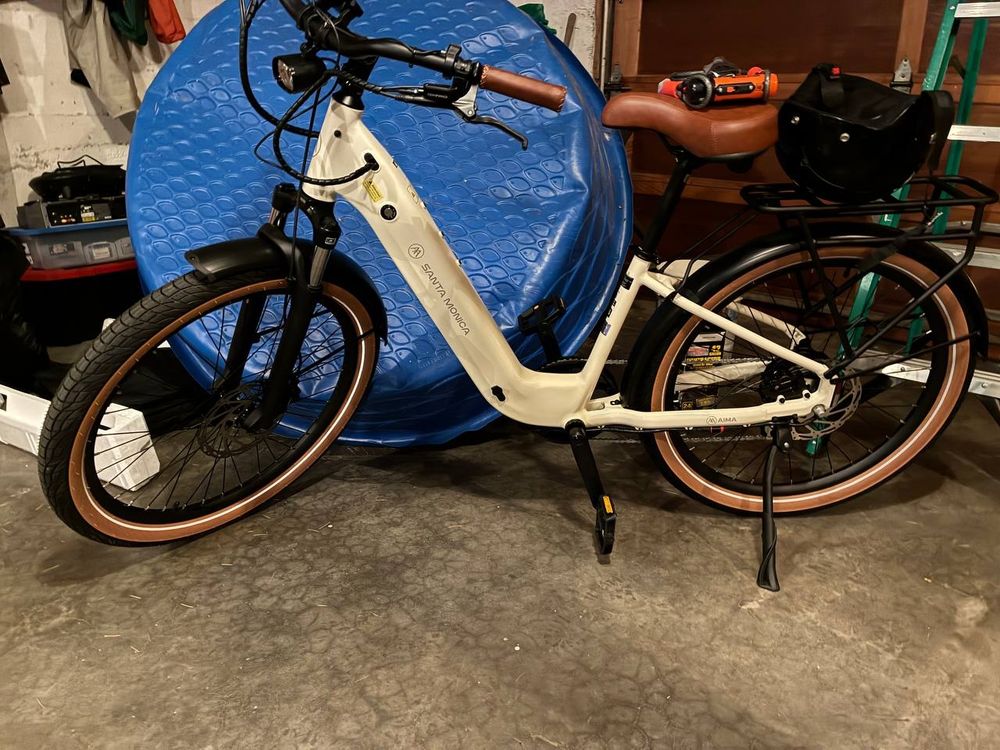 A new white E-Bike sitting in a garage
