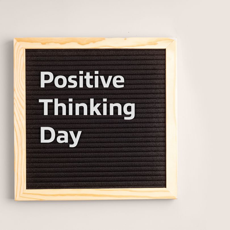 A letter box with the text "positive thinking day." 