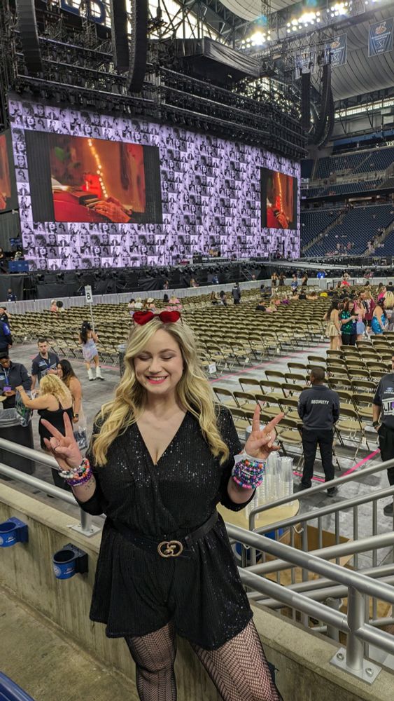 Me in a much cooler outfit in front of the eras stage