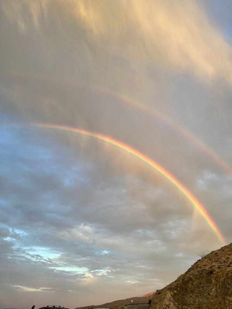 Sky with a double rainbow
