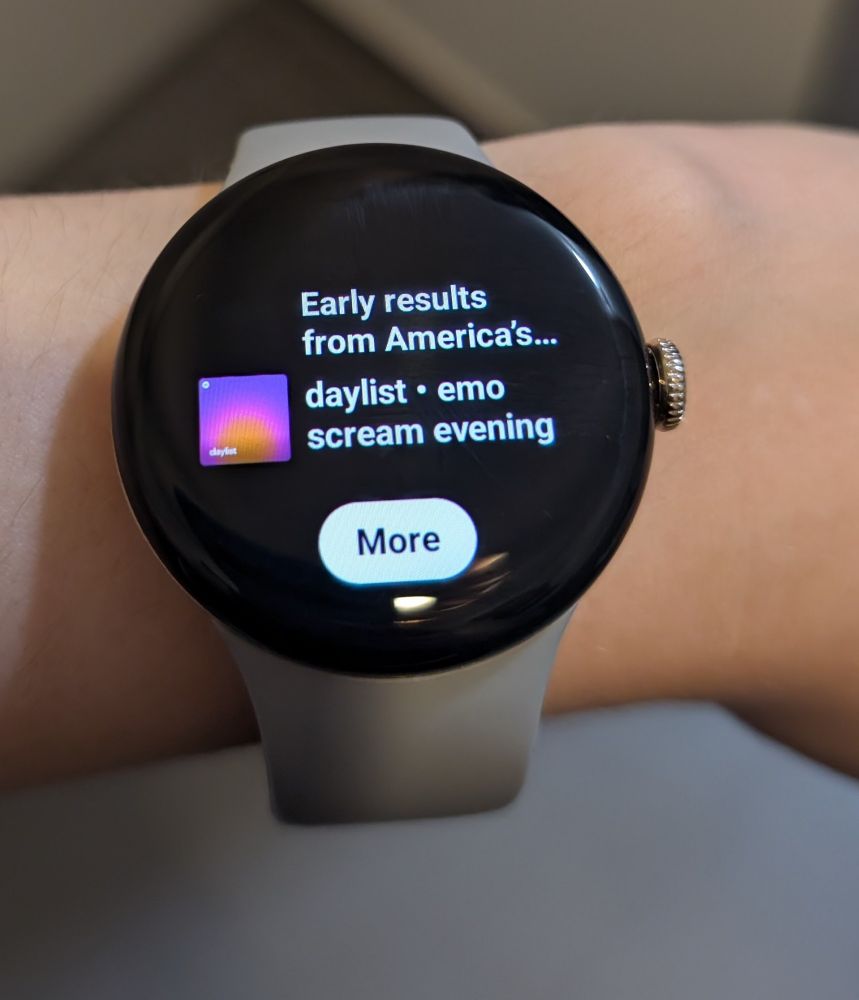Pixel Watch showing the Spotify recommendation widget with the text "early results from America's..." Followed by the day list called "emo scream evening"