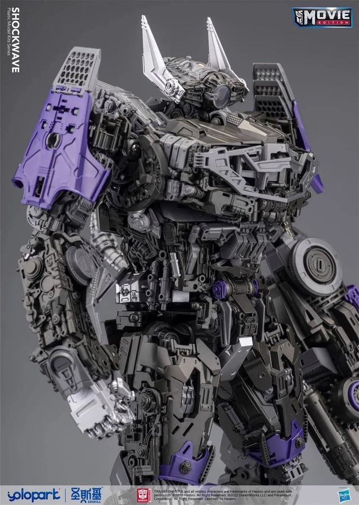 A stock photo of the Yolopark Shockwave Transformers plastic model kit. An unarmored photo of the main body, thighs, and arms showcasing the interior detail