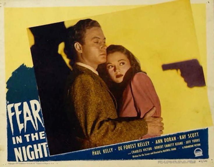 Promotional poster for Fear in the Night (1947) featuring DeForest Kelley and Ann Doran in front of a yellow wall, De’s arm protectively around Ann. 