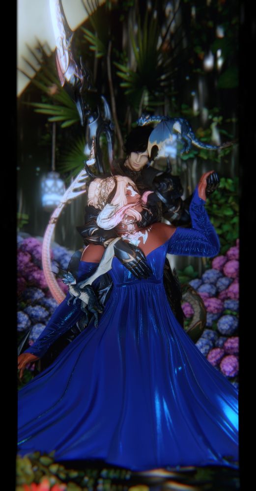 Ryuhiko (Raen Au Ra, he/him and she/her pronouns) and his husband (Hyur Midlander, he/him pronouns). Ryuhiko wears a shimmering blue dress, kneeling in the water at her husband's feet as he holds her hand and rests his other hand against her chest, his armored palm braced against her heart. Ryuhiko looks up at him with a gentle smile on his face, a smile that is returned. They are surrounded by greenery, the flow of water behind them, two dragonets, and a snake coils in the flowers behind them. They are in bliss in each other's company, together in the garden of paradise.