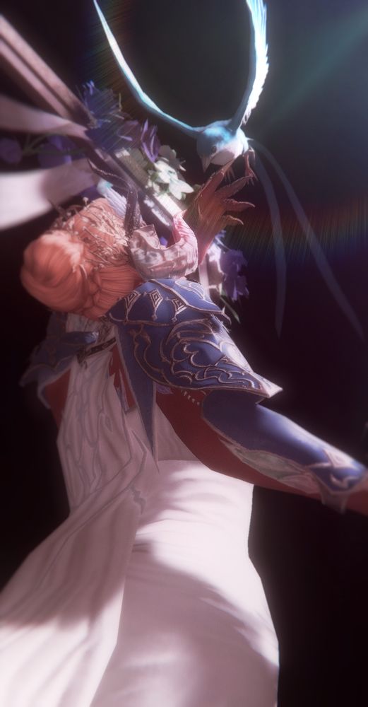 The same shot but from behind, showing the bird touching down towards Ryuhiko's hand.