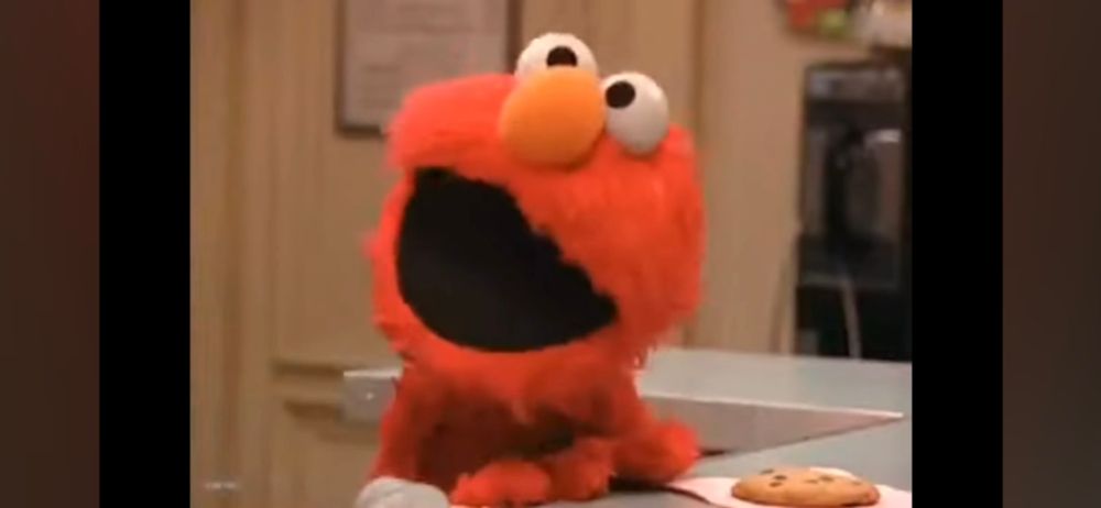 Elmo in a righteous rage over the fact that Zoe's pet rock Rocco gets the last oatmeal raisin cookie, despite being just a rock that has no mouth to eat it with.