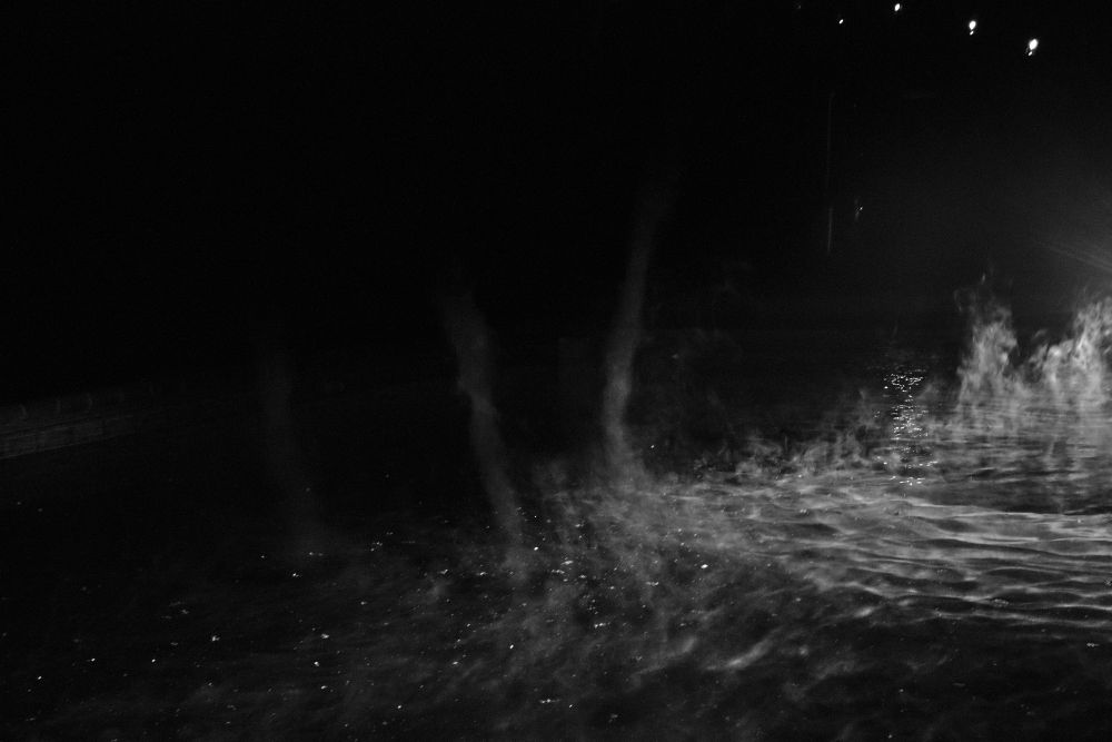 ... Three steam devils are visible in the center of the image.