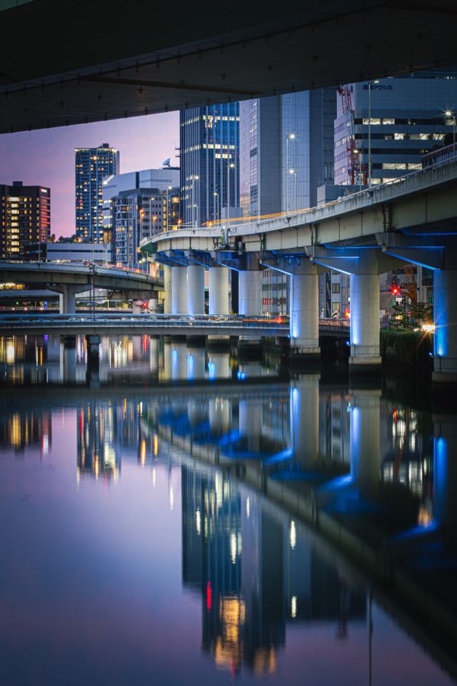 Evening shot of brisges and skyscrappers in Osaka