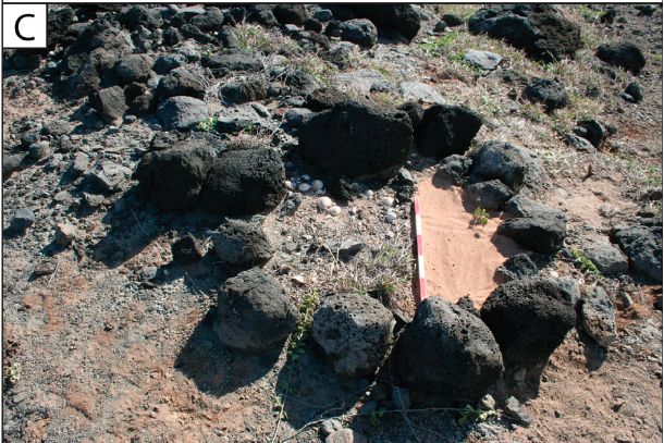 Photo of the area described as a shrine : a ring of small boulders and cobbles, where the western portion was excavated and then backfilled with clean sand