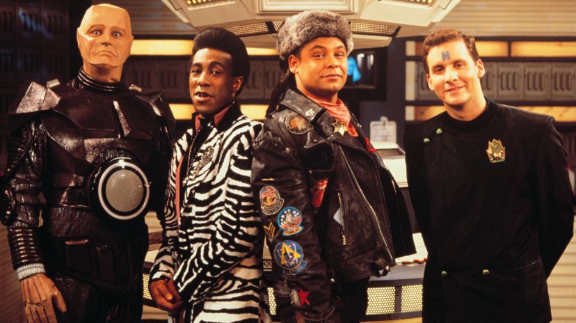 Red Dwarf cast. Left to right: Kryten, Cat, Lister, Rimmer