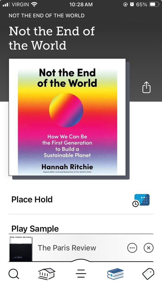 Image of the Libby audiobook of not the end of the world. The cover has a green, yellow pink and blue gradient