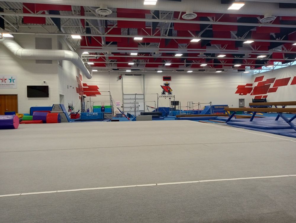 A large, empty gymnastics facility.