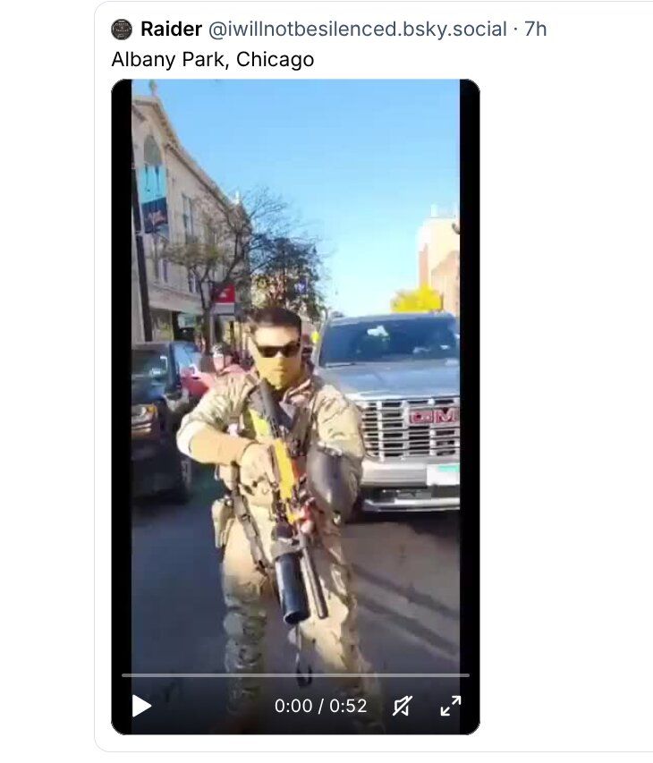 @iwillnotbe silenced.bsky.social posts vid from Albany Park, Chicago showing an ICE thug pointing a gun