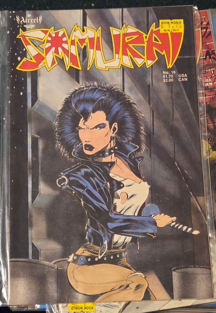 A big hour punk girl with barely there t-shirt, leather jacket and sword
Art by Dake Keown