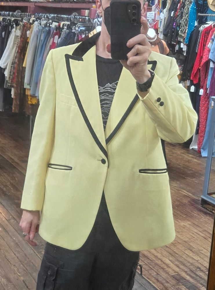 A yellow tuxedo jacket with black trim