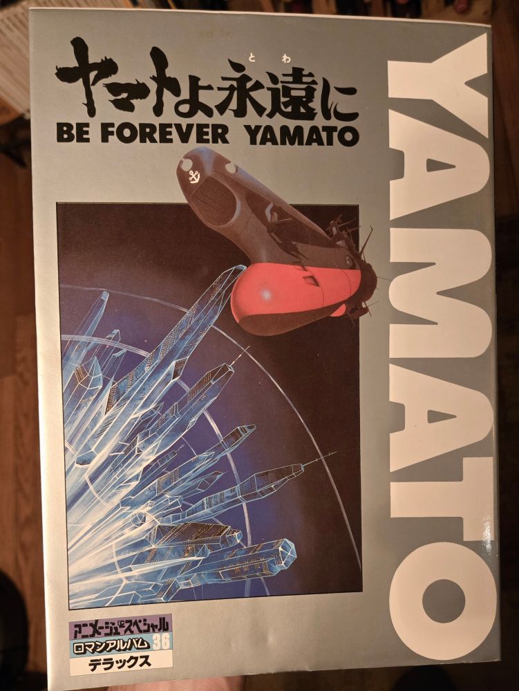 Be Forever Yamato (ヤマトよ永遠に, Yamato yo Towa ni) artbook cover with Argo  against silver.