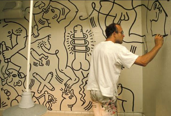 Keith haring painting a mural of dicks, rimjobs, and gay men fucking