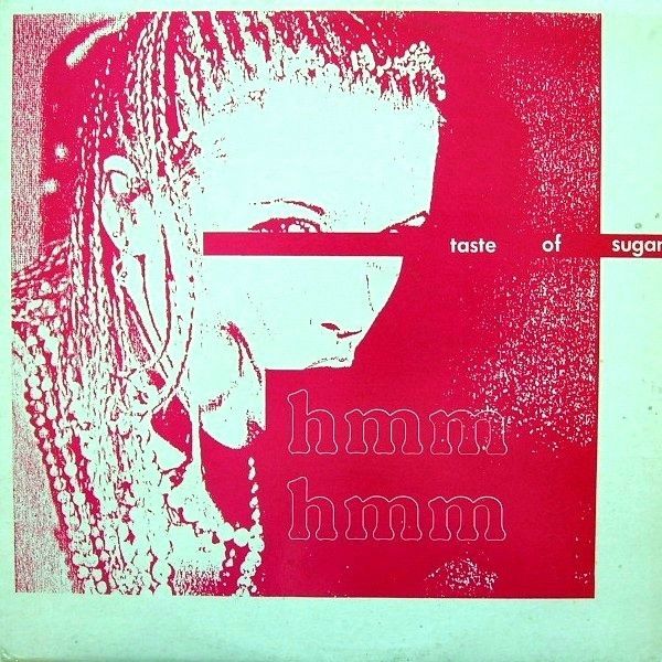 A red on white record sleeve for Taste of Sugar's Hmmm Hmmm. A woman covered in beads whose eyes and mouth are blocked out,  but appears to be doing something pornographic.