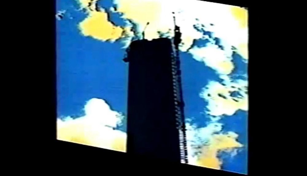 a tower with a cloudy blue sky