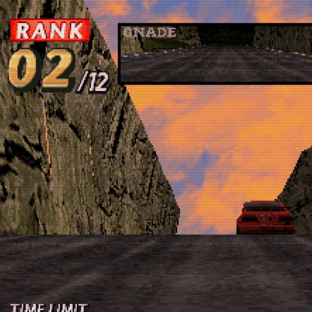 car driving beside a tall cliff at dusk