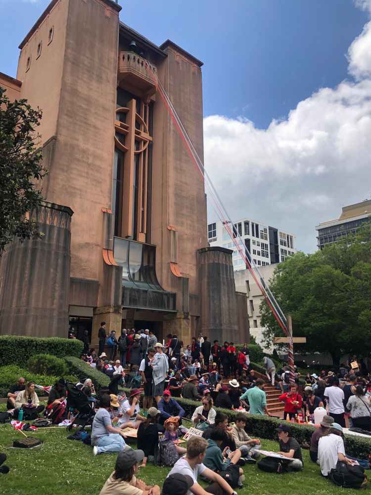 Sausage sizzle out the front of the Wellington Cathedral of St Paul with red, white and black ribbon decorations