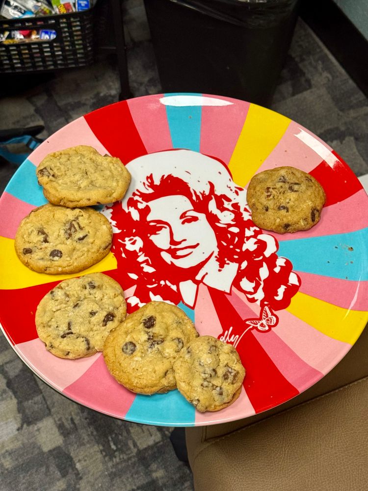 a rainbow Dolly plate with some cookies 