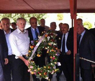 Corbyn holding a wreath at Hamman Chott Cemetery, Tunis, 2014
Source: https://en.wikipedia.org/wiki/Corbyn_wreath-laying_controversy
