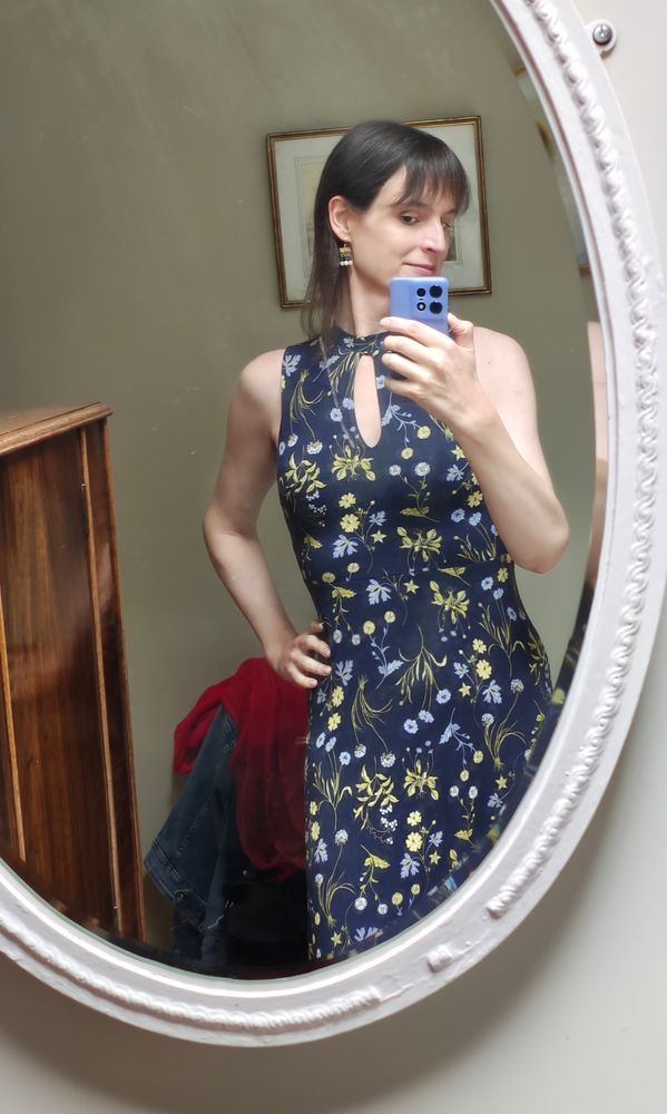mirror selfie in dark floral dress, arms exposed