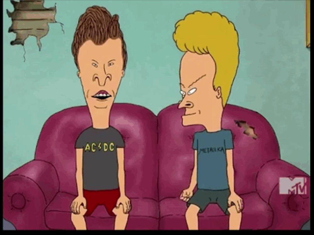 two cartoon characters are sitting on a couch one is wearing a ac dc shirt and the other is wearing a metallica shirt