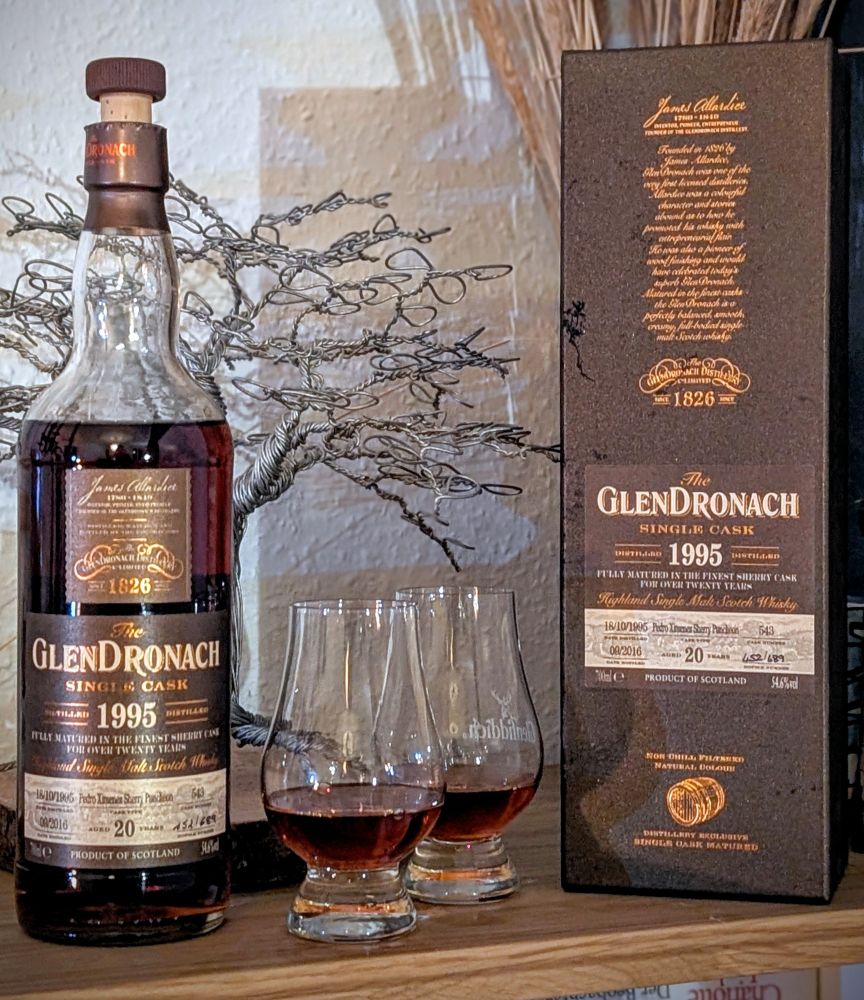 Bottle of Glendronach whisky next to two glasses and the box