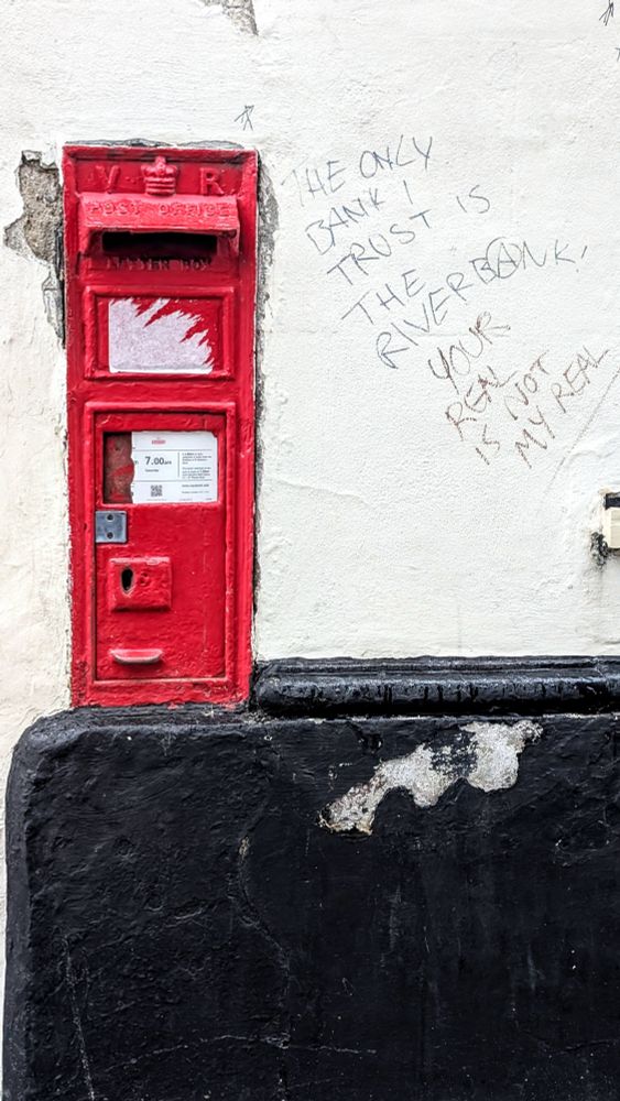 VR wall box spotted in Norwich, set in an old white wall with a black base