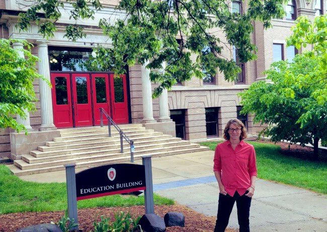 Allison Lombardi standing in front of the Education Building at UW Madison