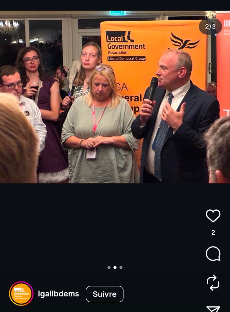 Two pissed off trans women observing Ed Davey talk about something.