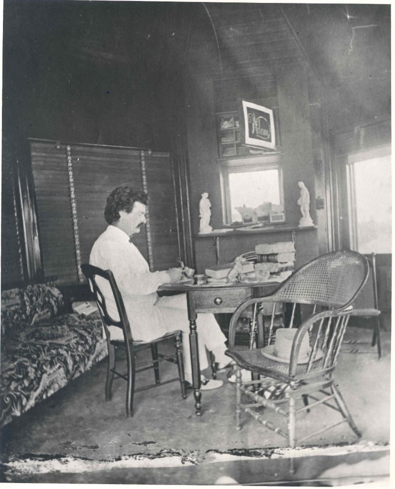 Samuel Clemens aka Mark Twain sitting at his writing desk at Elmira College in Elmira, New York.
