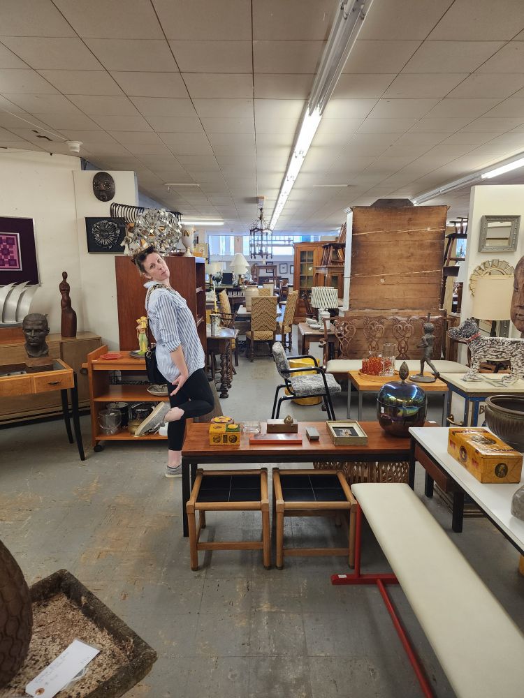 Daryn showing off the archival holdings in a holding space in Onteora, New York.