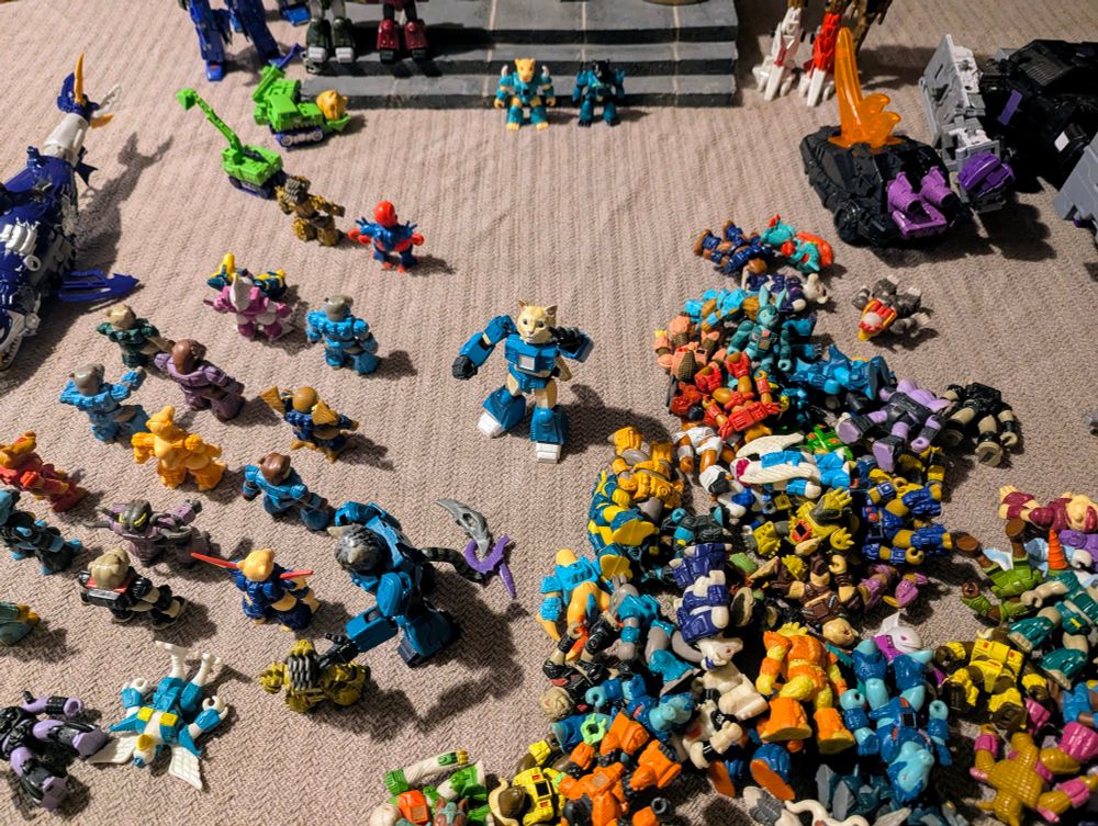 Leo and Milly the cats in their battle armor lining up rows of battle beasts around a throne room for some reason.
