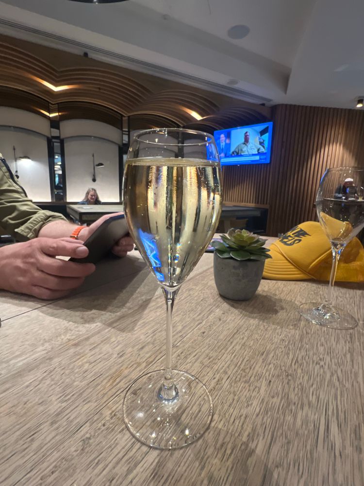 A glass of sparkling wine in a very ordinary airport bar in Melbourne, Australia 
