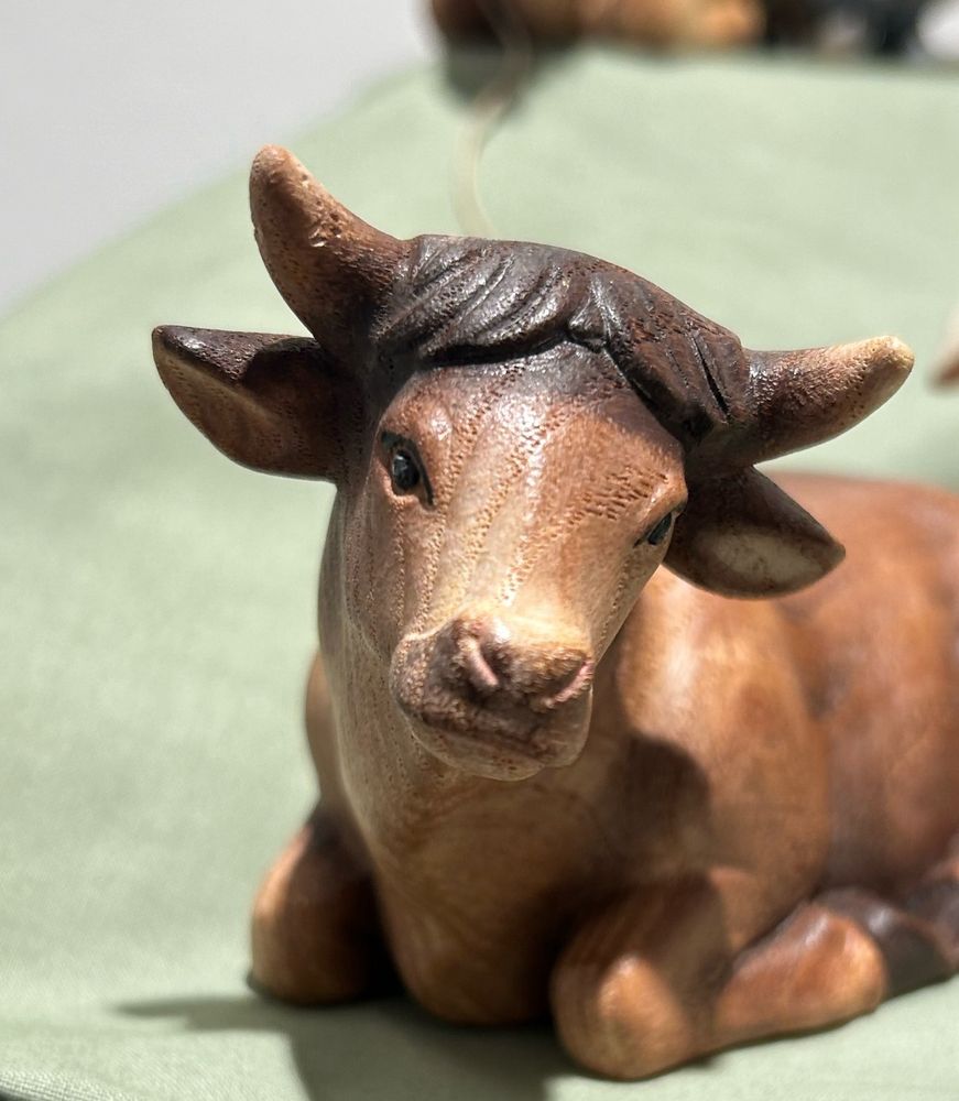 A Pictures of a very cute porcelain cow with bangs and nice winged eyeliner 